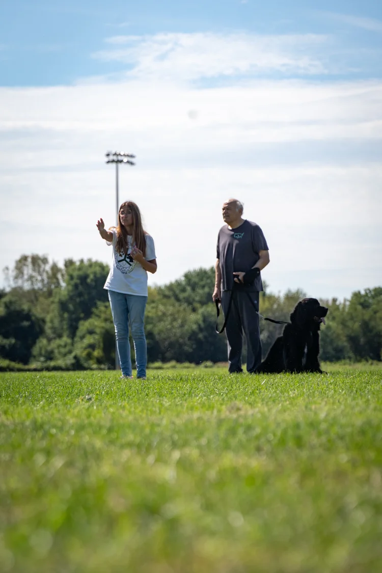 Nancy guiding a client and their dog