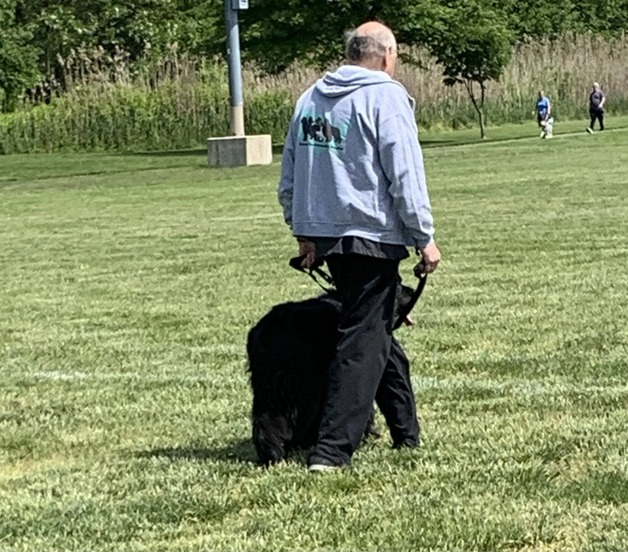 Client walking with their dog at a Peace Walk